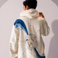 Close-up detail of Across the Globe Hoodie showing globe artwork, arctic tern, coordinates and polar landscapes