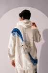 Close-up detail of Across the Globe Hoodie showing globe artwork, arctic tern, coordinates and polar landscapes