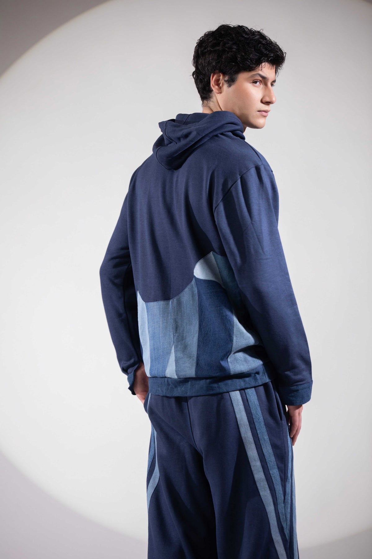 Back of Distance → Illusion Hoodie with abstract glacier and fractured ice patchwork