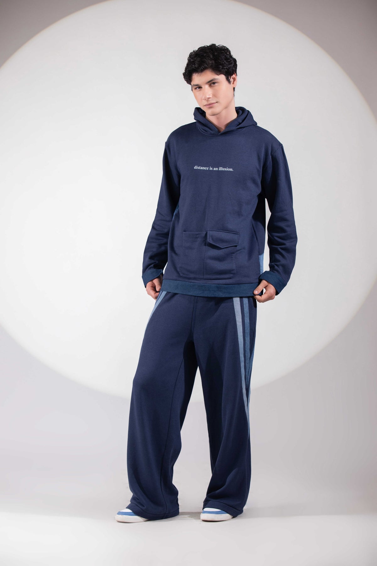 Distance → Illusion Hoodie showing layered reconstructed blue denim panels