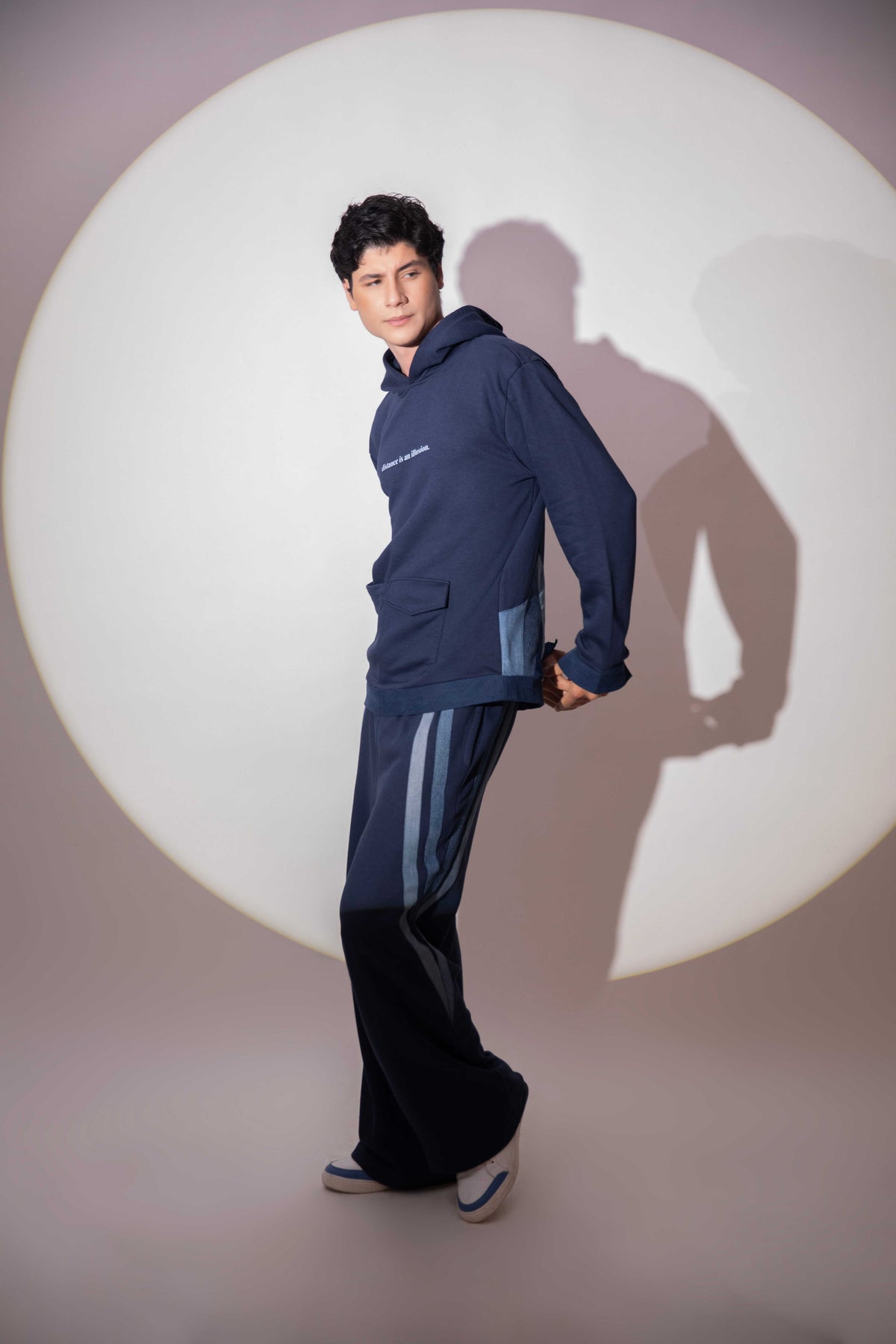 Side view of Distance → Illusion Hoodie showing oversized reconstructed denim silhouette