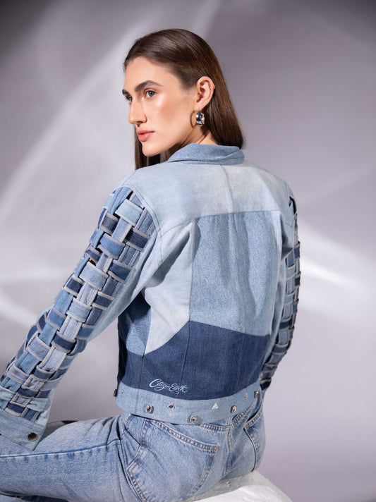 Back view of Drift Weave Denim Jacket showing woven denim sleeves and panel construction