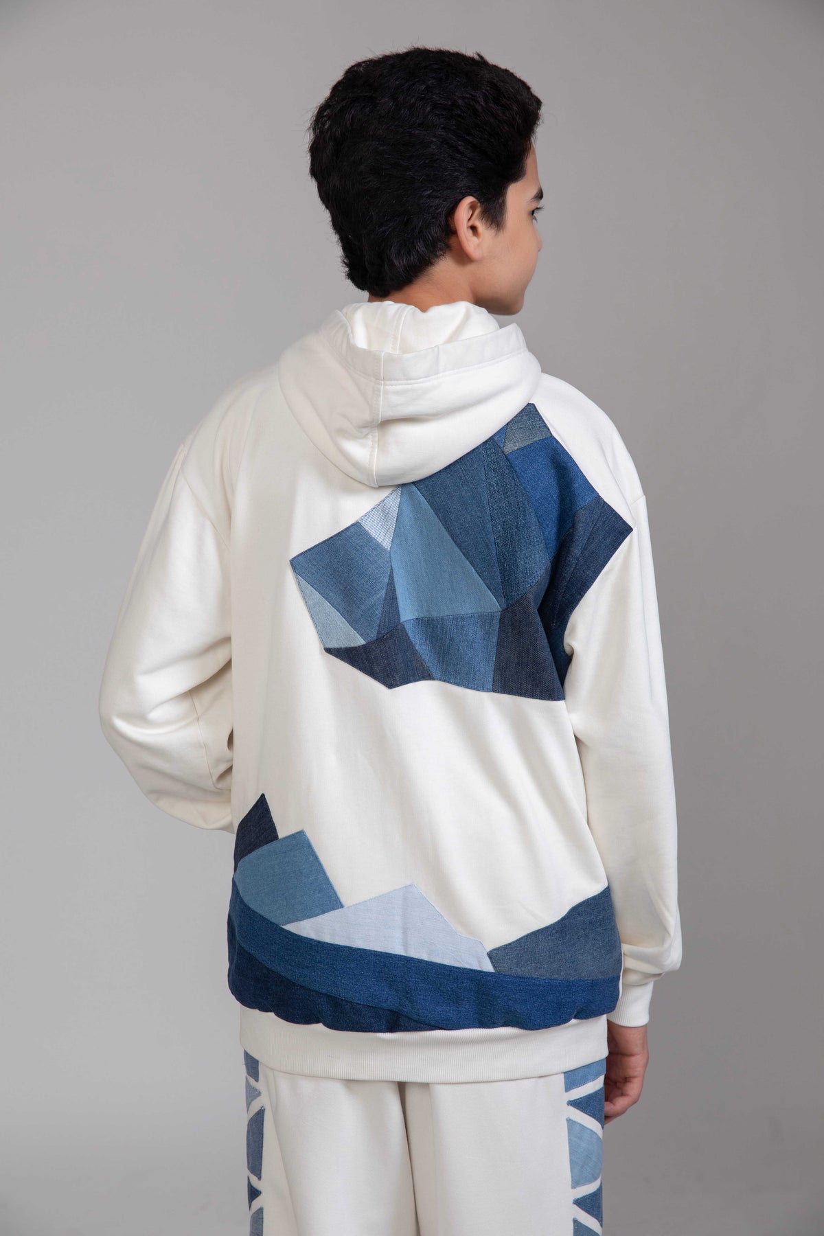 Endurance Hoodie with polar bear and glacier landscape in reconstructed denim patchwork