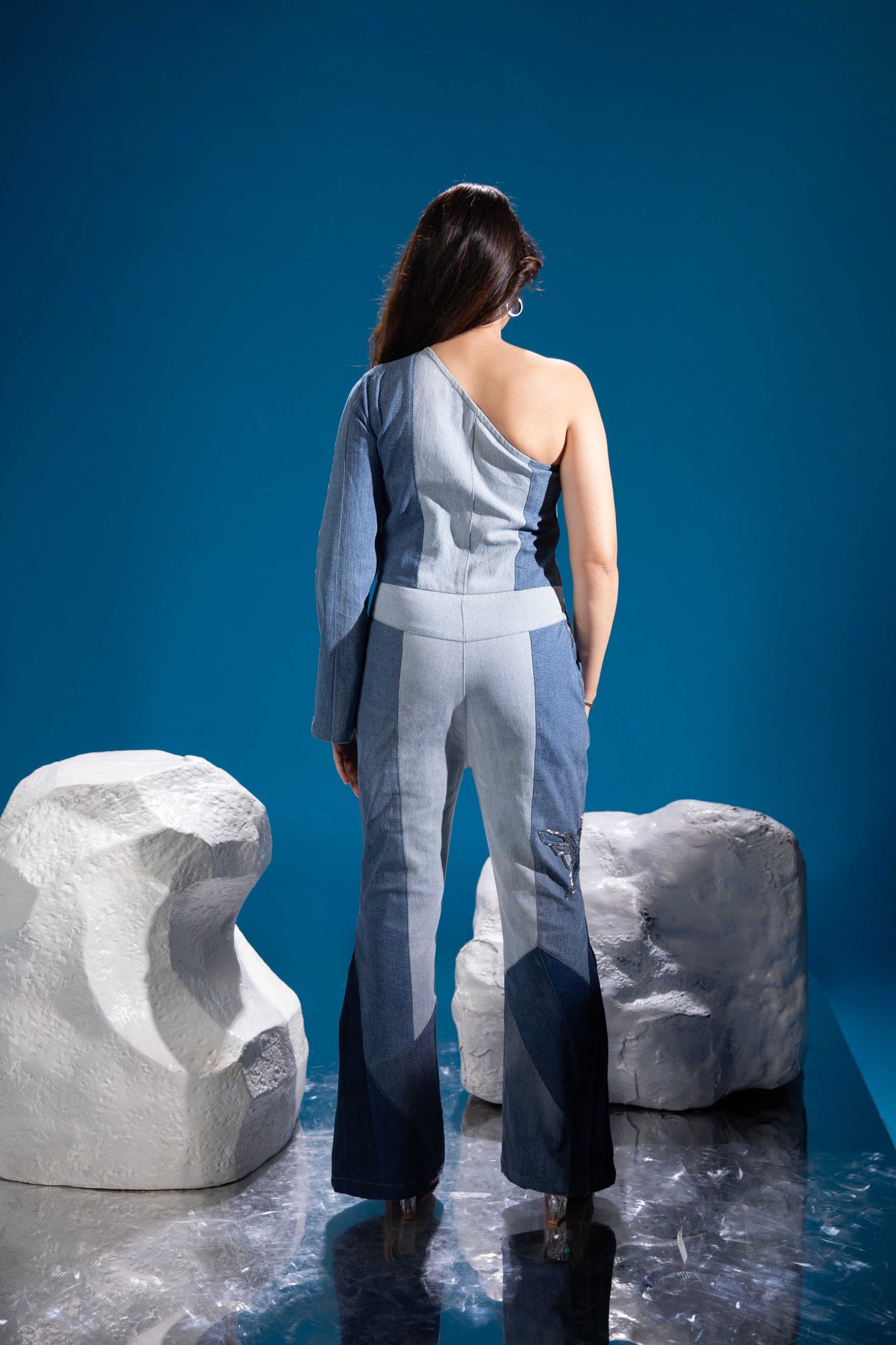 Back view of Fearless Ferð Denim Jumpsuit in repurposed denim