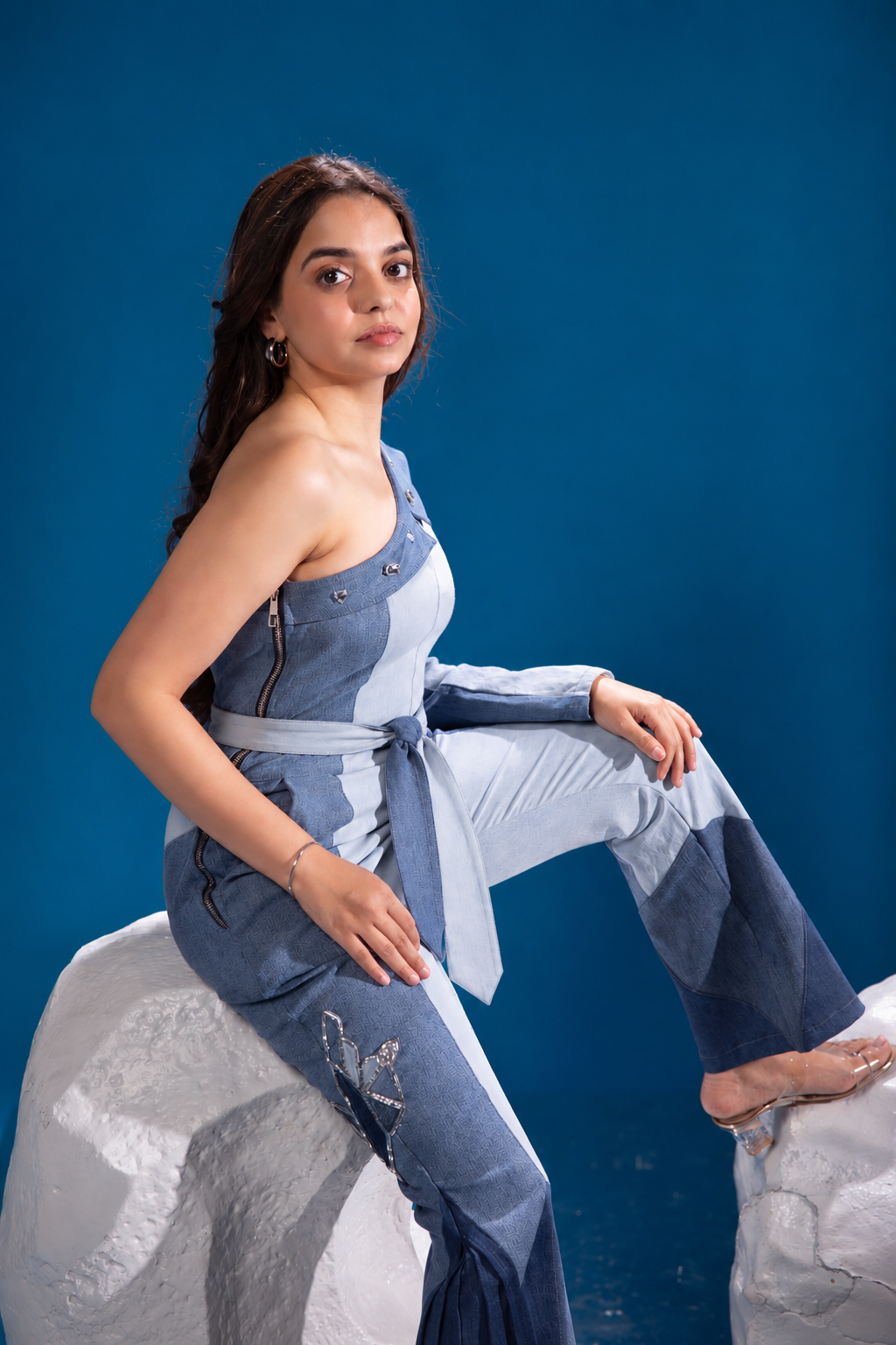 Fearless Ferð Denim Jumpsuit with one-shoulder silhouette and flared denim leg