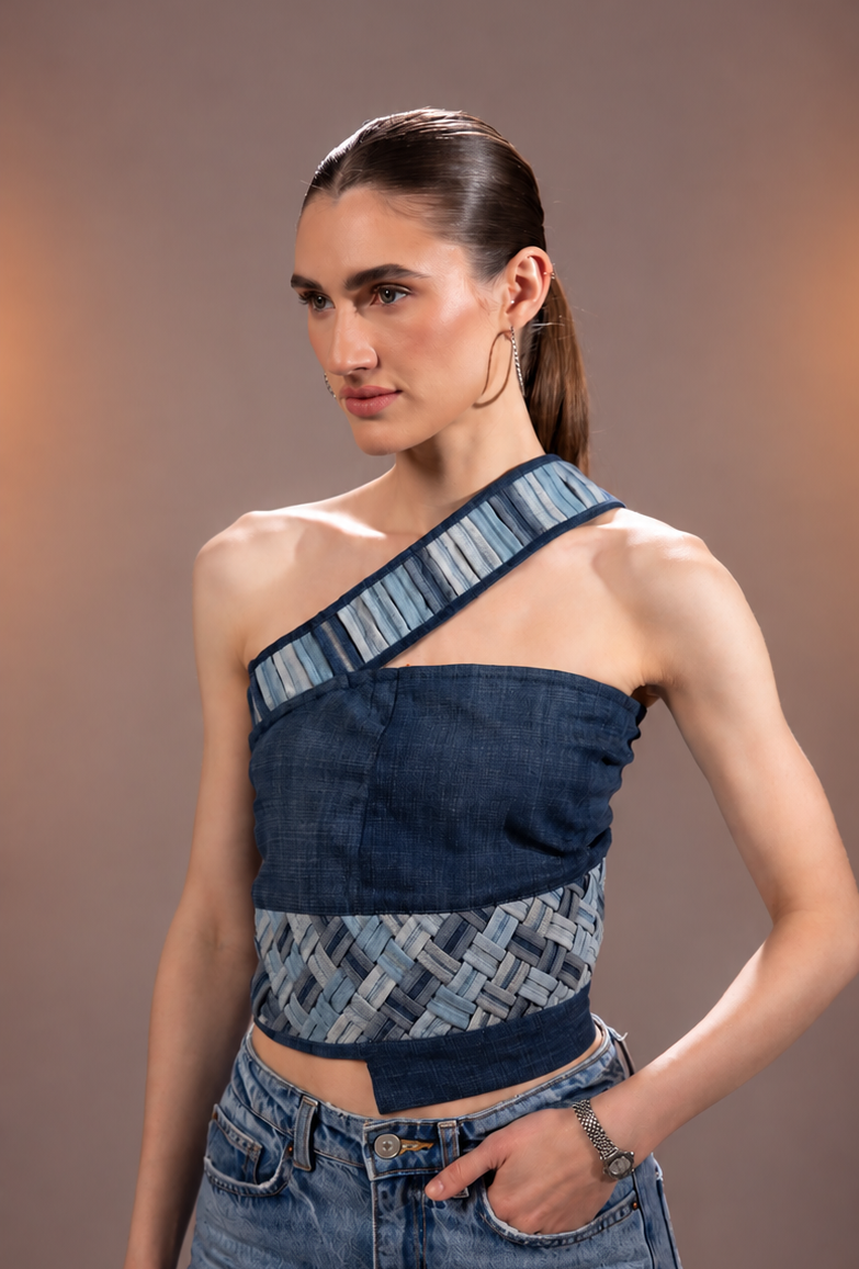 Side view of Flowform Denim Top showing its asymmetric single-sleeve silhouette
