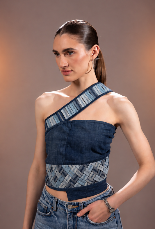 Side view of Flowform Denim Top showing its asymmetric single-sleeve silhouette