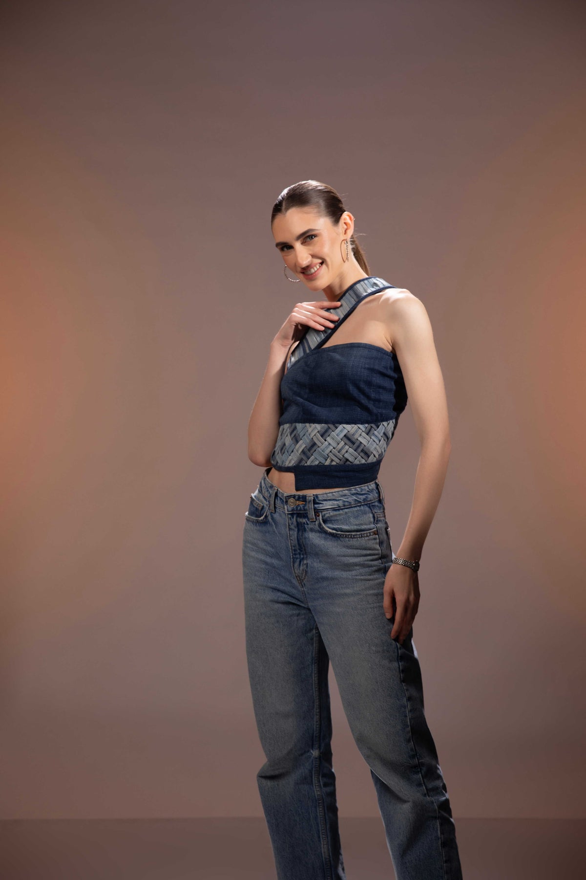 Flowform Denim Top showing repurposed denim panelling and weaving