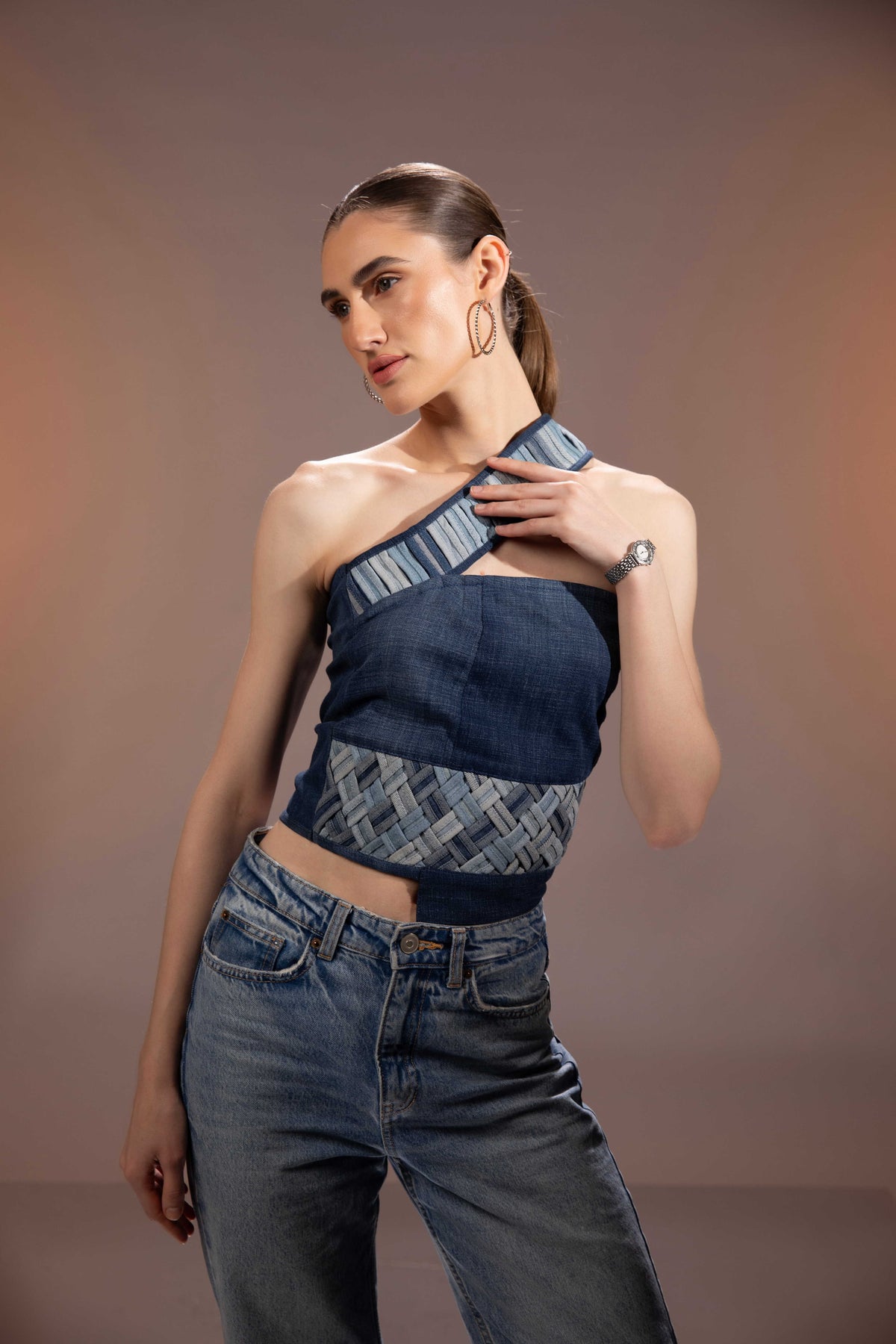 Close-up of Flowform Denim Top showing interlocking spiral denim panels