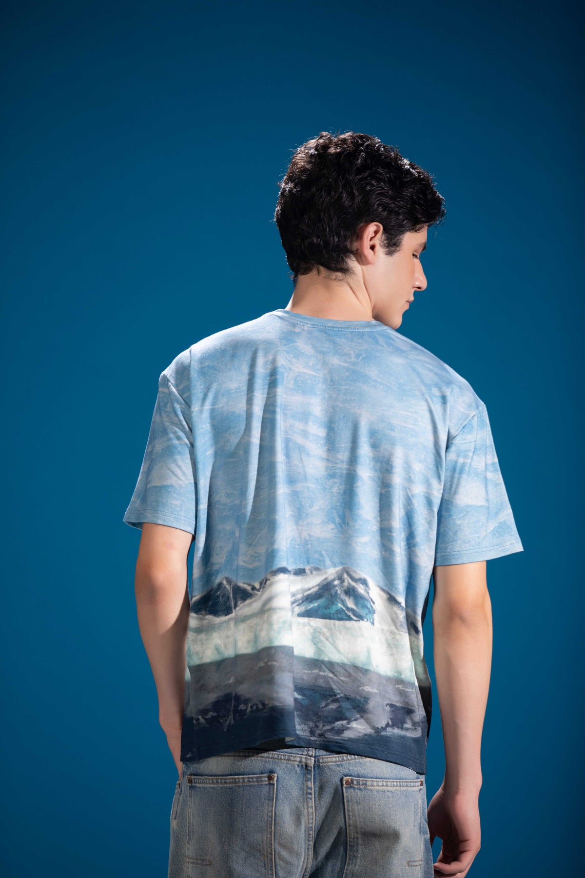 Close-up of Frozen Landscape Tee showing layered glacial landscape artwork