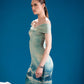 Side view of Frozen Reflections Dress showing its sculptural silhouette
