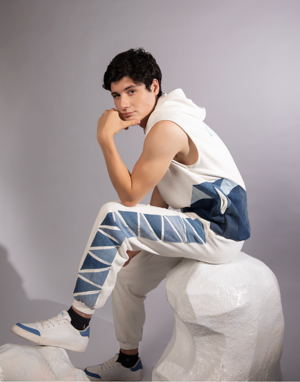 Glacial Geometry Jogger featuring angular blue denim panels inspired by fractured ice