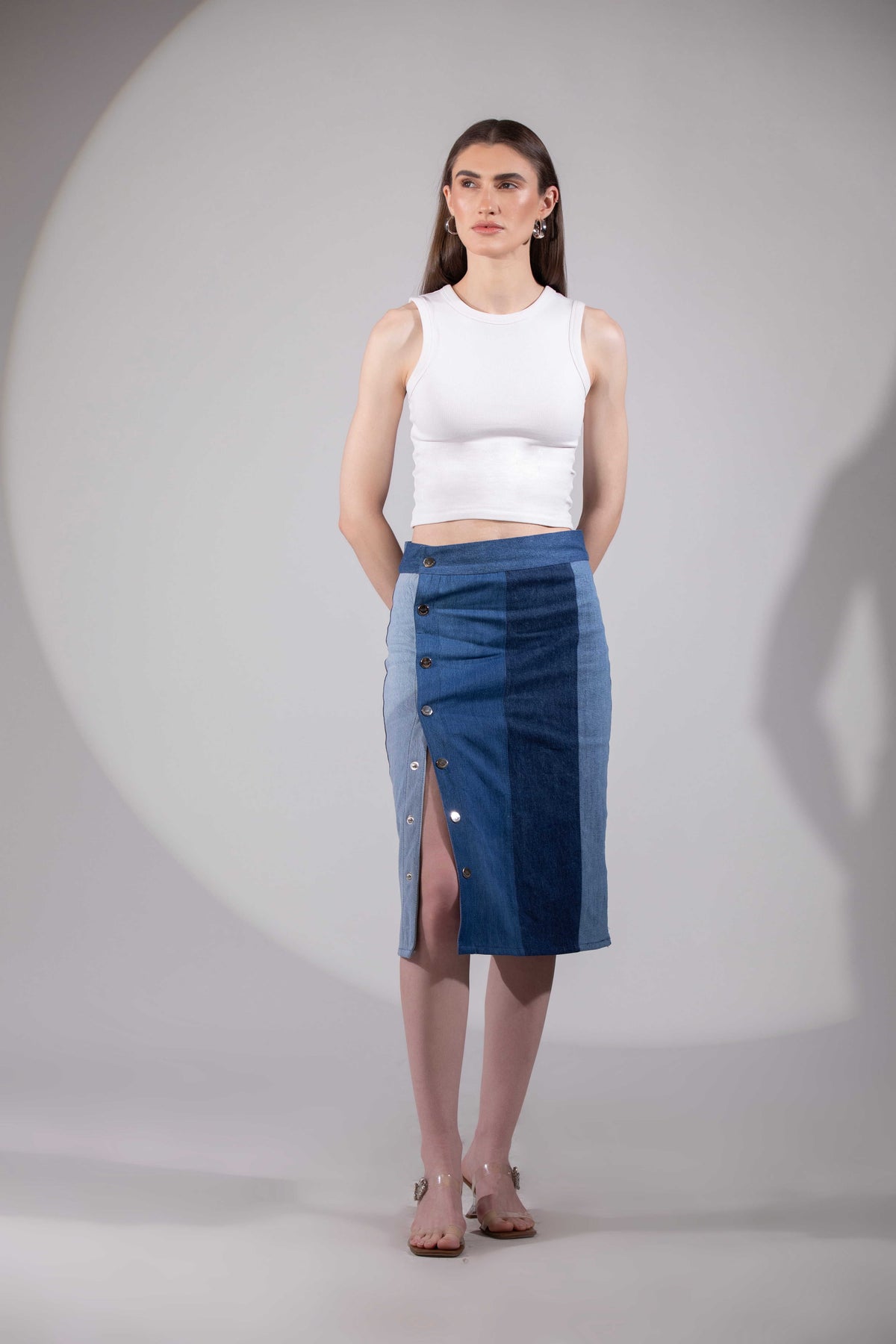 Close-up of Glacial Symmetry Skirt showing its geometric denim panel construction