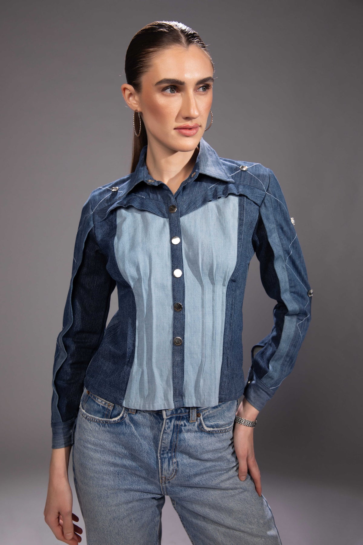 Glacier Cut Denim Top showing its sculptural denim panel construction