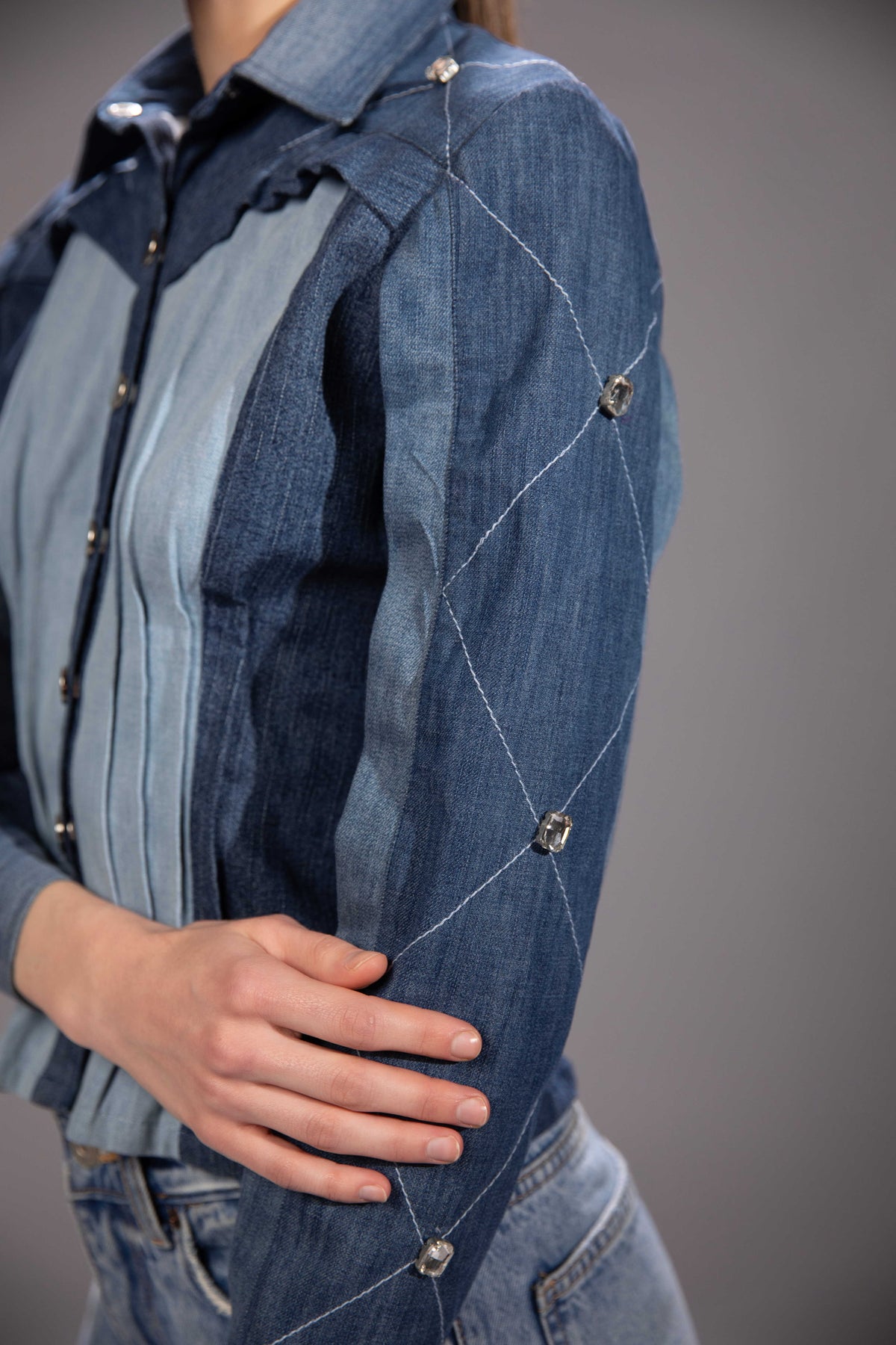 Close-up of Glacier Cut Denim Top showing glacier-inspired denim construction