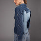 Side view of Glacier Cut Denim Top showing its sculptural silhouette