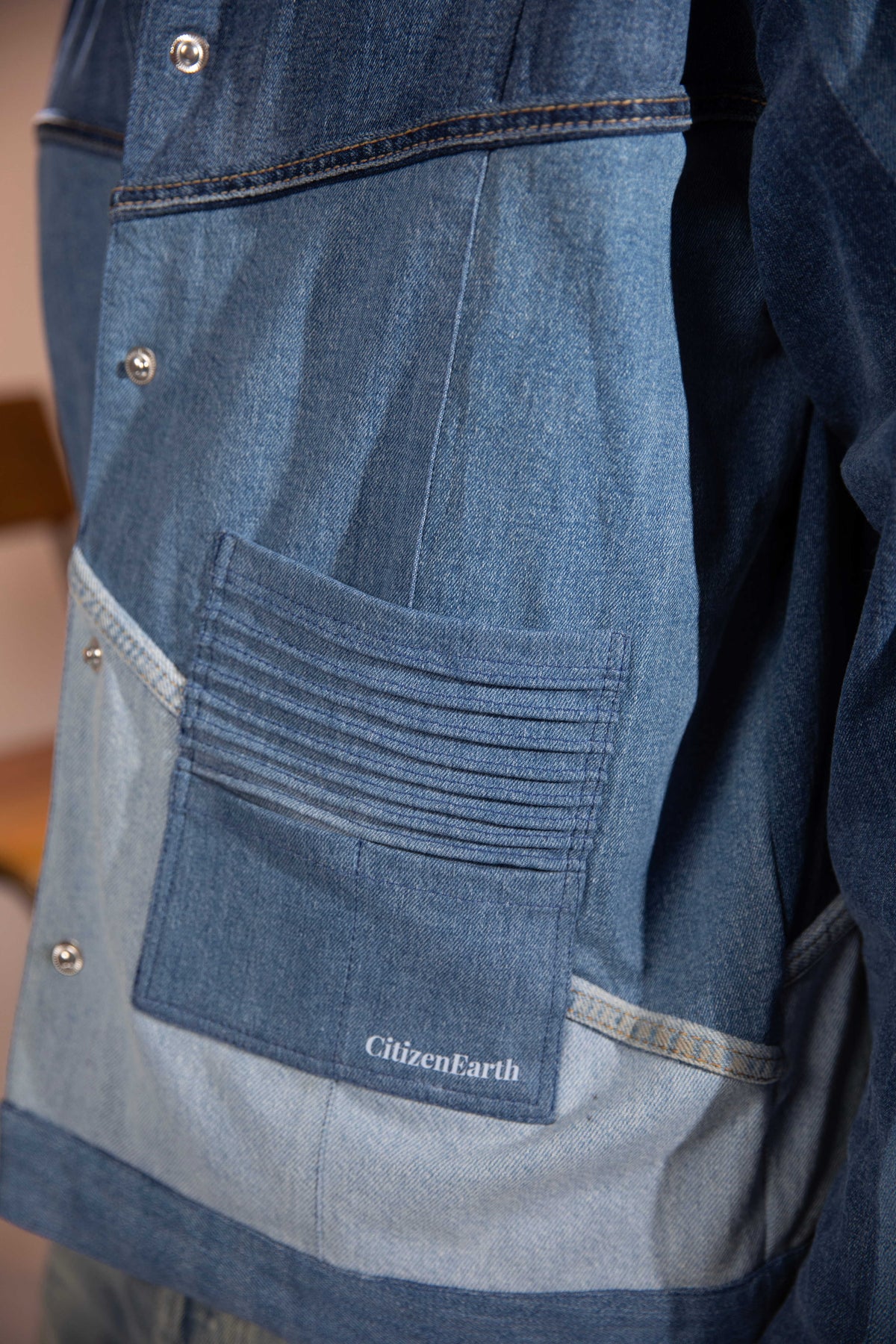 Close-up of Glacier Ridge Denim Jacket showing geometric repurposed denim panels