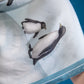 Close-up of Happy Feet Club Scarf showing penguin artwork