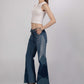 Side view of Hues of Blues Jeans showing the flared silhouette