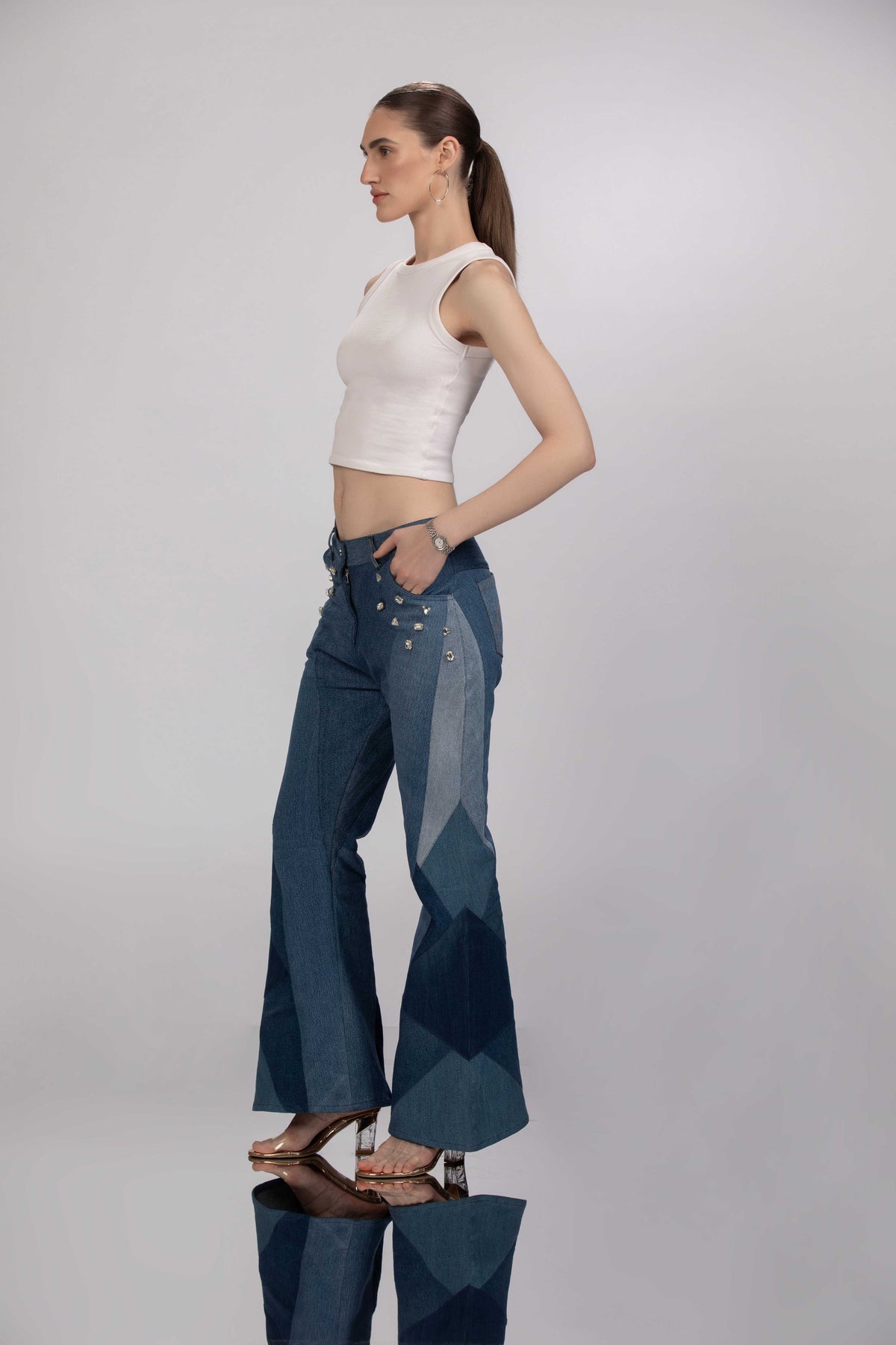 Side view of Hues of Blues Jeans showing the flared silhouette