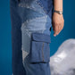 Ice Prism Denim Jumpsuit showing glass bead embellishment across the denim patchwork