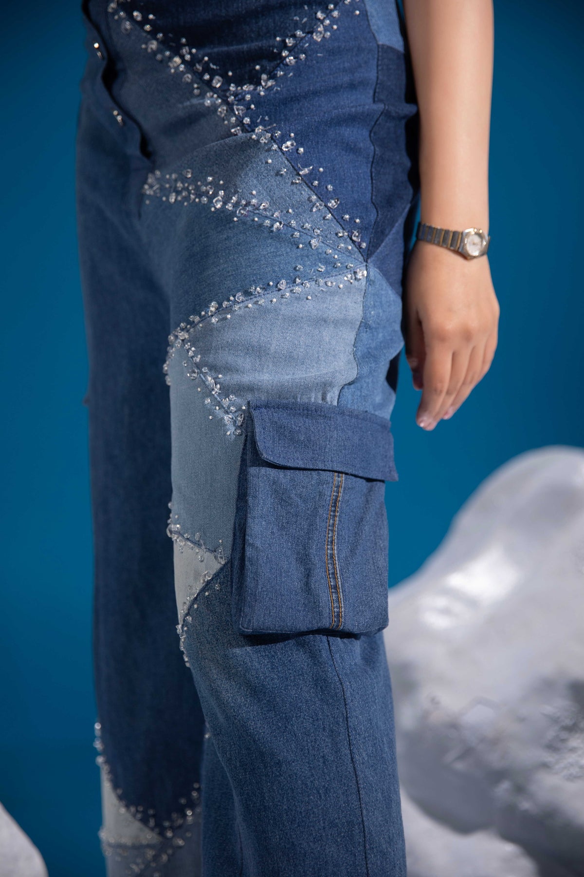 Ice Prism Denim Jumpsuit showing glass bead embellishment across the denim patchwork