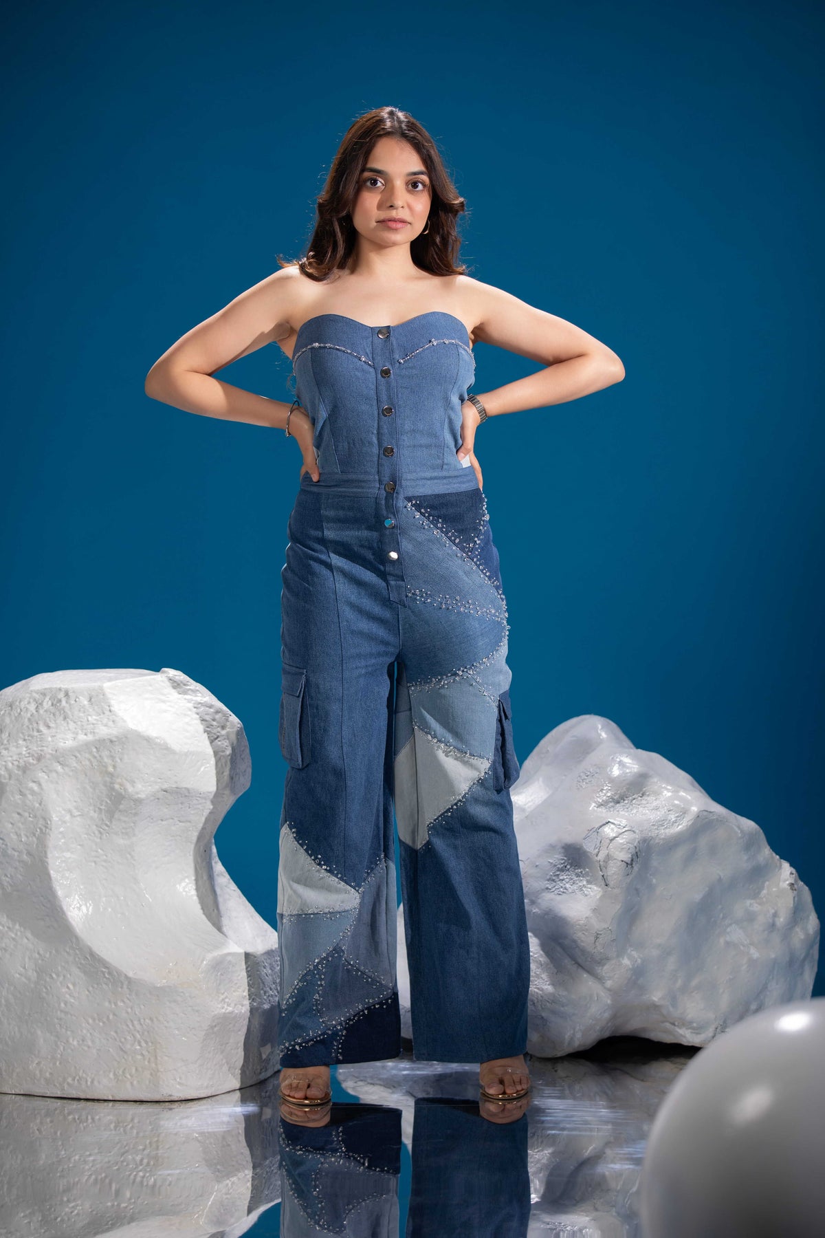 Close-up of Ice Prism Denim Jumpsuit showing triangular denim patchwork