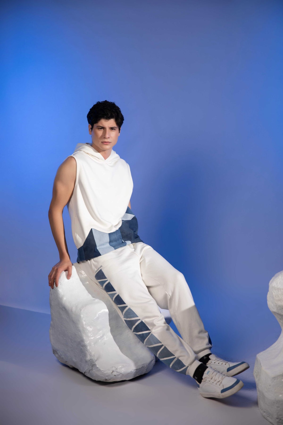 Layered Sleeveless Hoodie in reconstructed denim with blue glacier-inspired patchwork