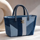 Meridian Mini Tote Bag showing contrasting ice-blue and deep-indigo denim panels