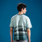 Close-up of Mountain Reflection Tee showing glacial mountain reflection artwork