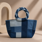 Close-up of Pack Ice Handbag showing textured repurposed denim patchwork