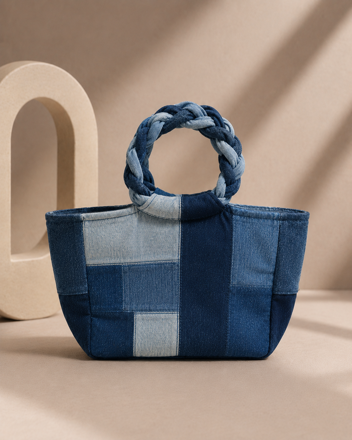 Close-up of Pack Ice Handbag showing textured repurposed denim patchwork