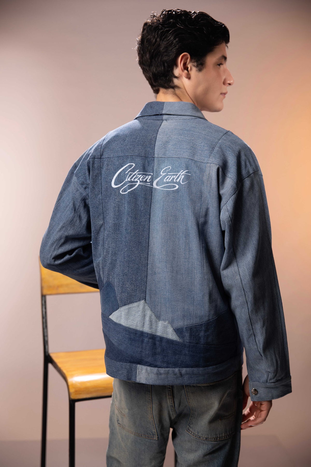 Back of Polar Divide Denim Jacket featuring glacier-inspired denim patchwork