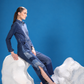 Side view of Polar Terrain Denim Jumpsuit showing its structured silhouette