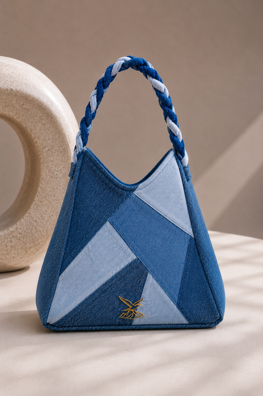 Serac Handbag showing faceted ice-blue and deep-indigo denim panels
