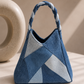 Serac Handbag featuring a structured rolled denim top handle