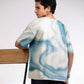 Close-up of Shadow of the North Tee showing swirling Arctic pack ice artwork