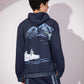 Close-up of Shared World Hoodie showing penguins, whales and glacier artwork