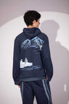 Close-up of Shared World Hoodie showing penguins, whales and glacier artwork