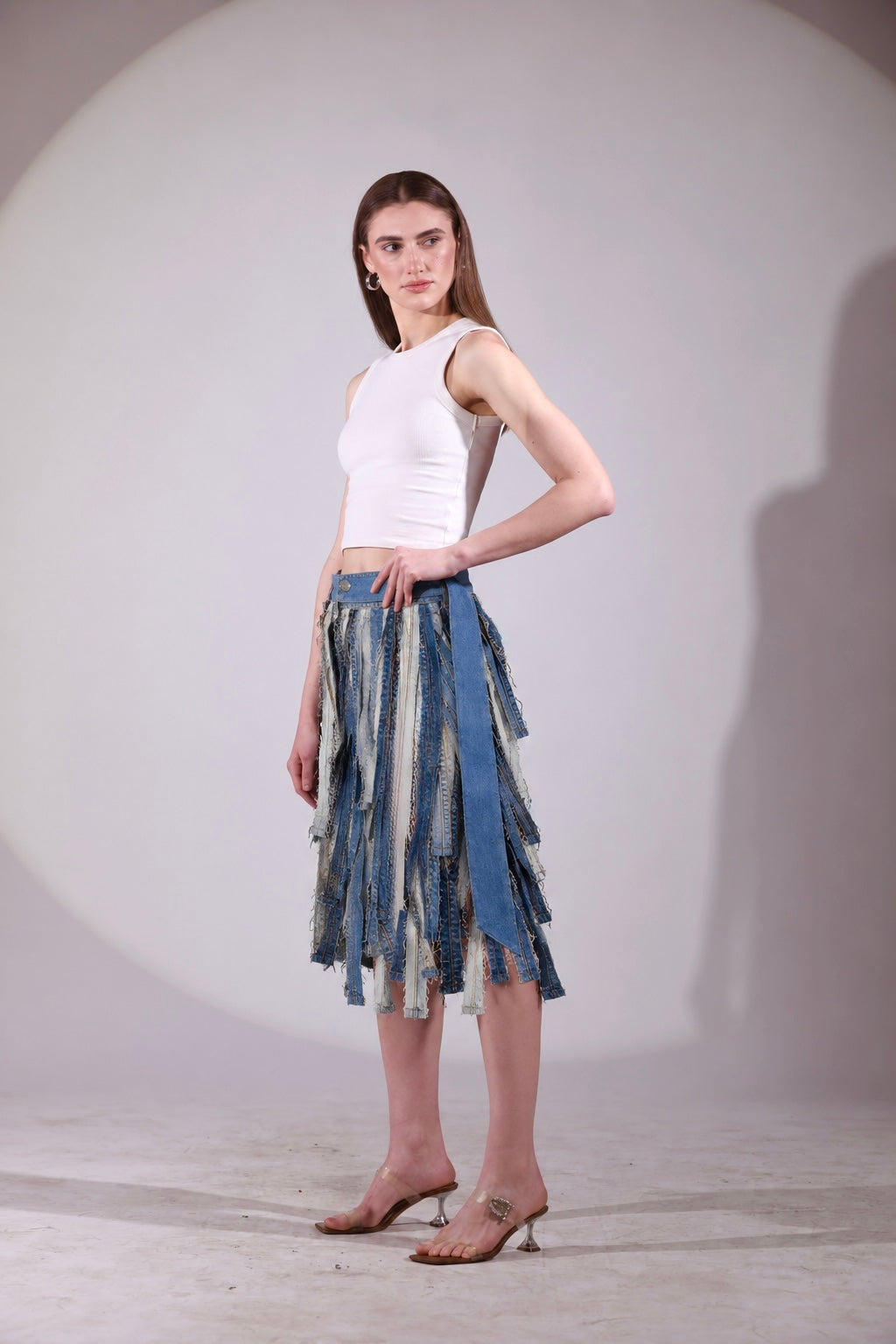 The Meltwater Skirt showing layered repurposed denim strips in motion