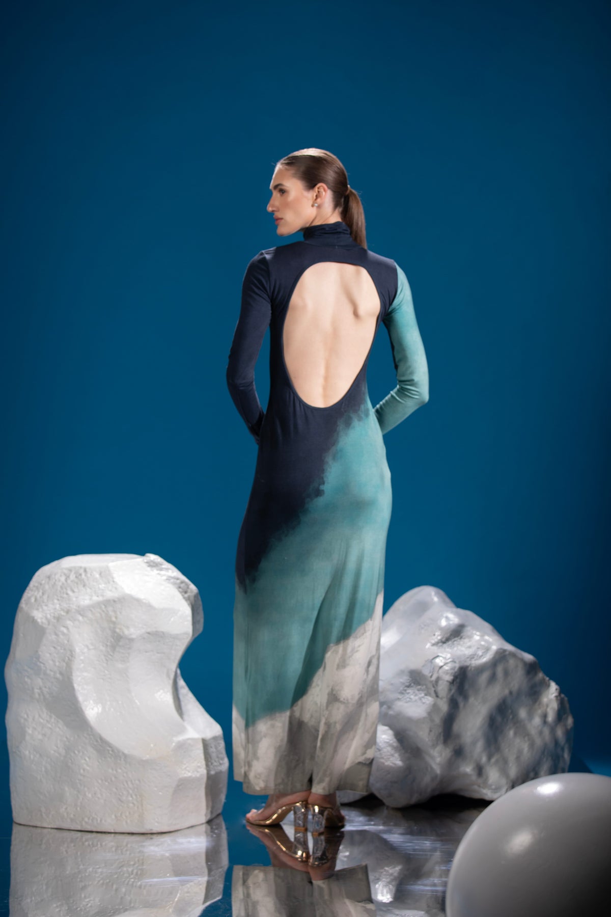 Back view of Tri Tone Polar Dress featuring an open-back design